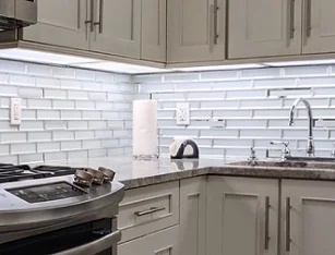 Modern kitchen with stainless steel appliances; Granite countertop and backsplash in kitchen